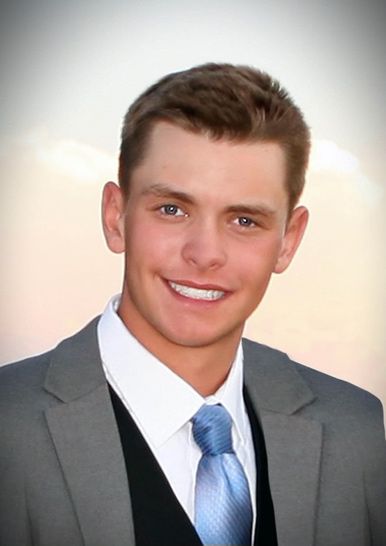 A person in a suit and tie

Description automatically generated with medium confidence