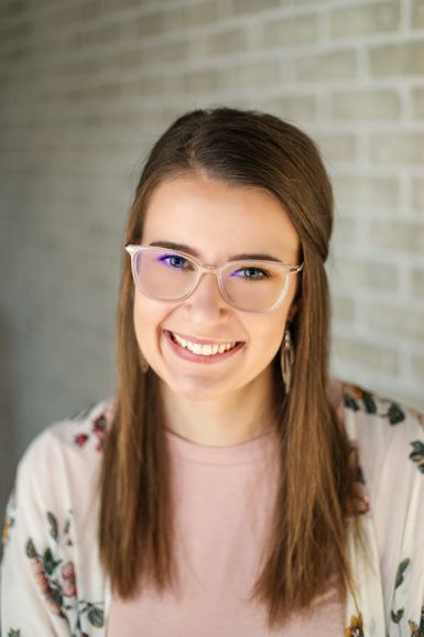A person wearing glasses 
      
 Description automatically generated with low confidence